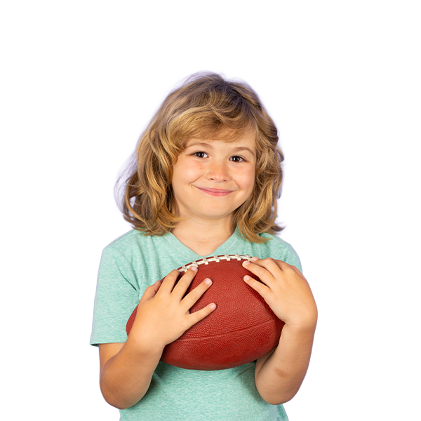 Smiling boy holding a football