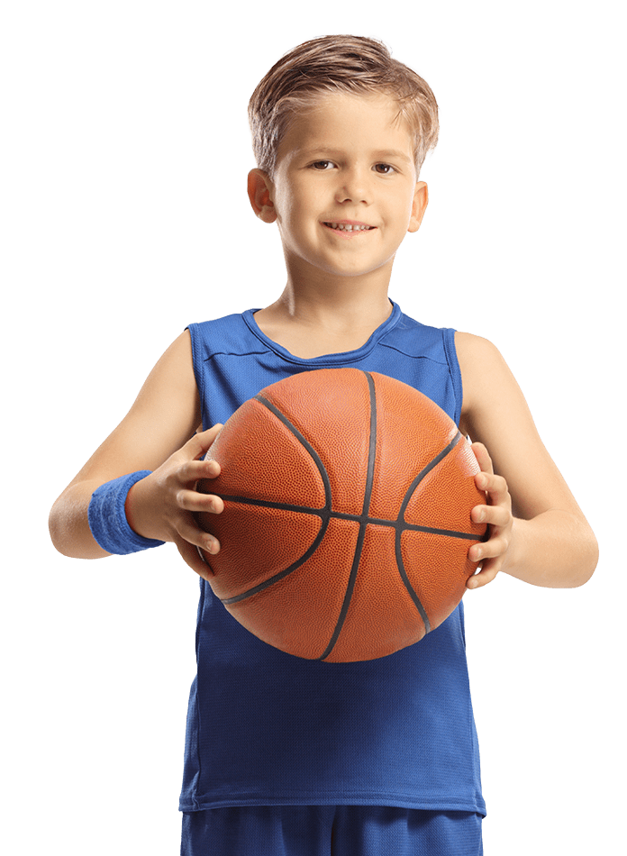 Smiling boy holding a basketball